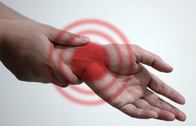 hands isolated on white demonstrating carpal tunnel syndrome pain